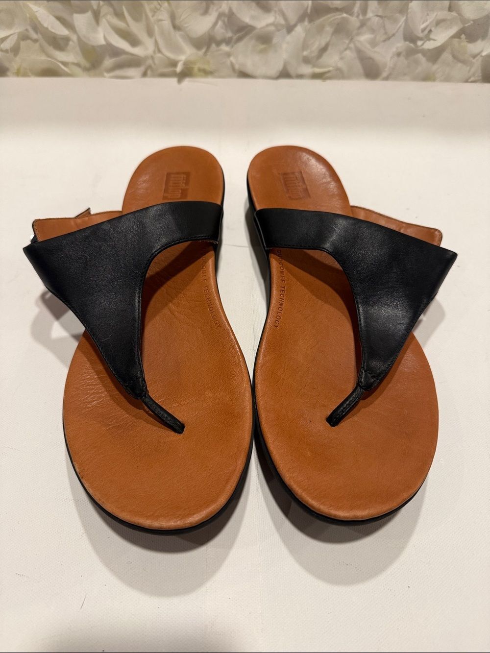 FitFlop Black Leather Thong Sandals with Brown Footbed